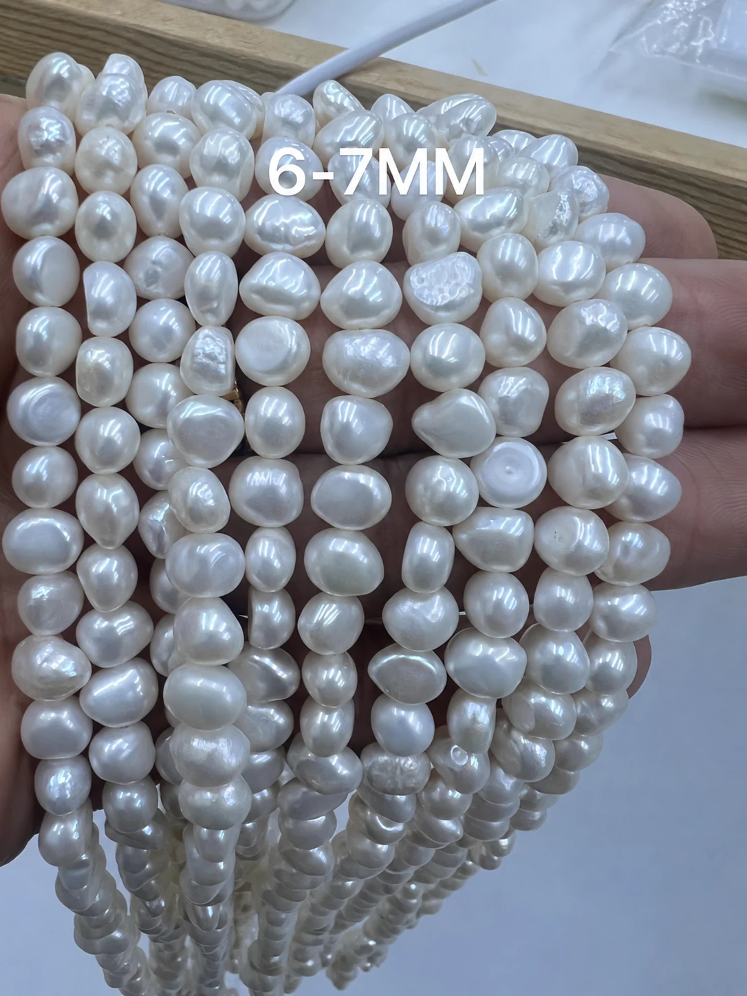 6 to 7mm white baroque freshwater pearl strands without price text