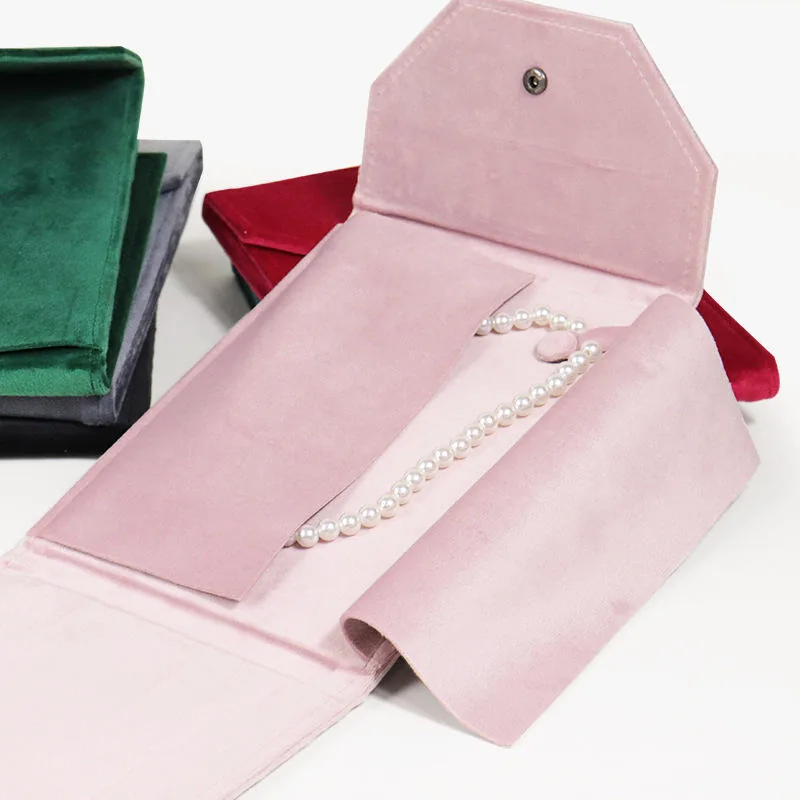 Pink folding pearl necklace pouch with white freshwater pearl strand